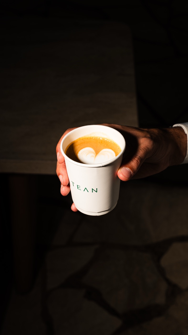 A TEAN latte served by hand